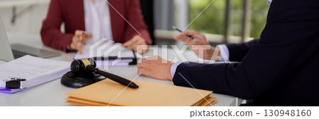 Lawyers attorneys adult legal professionals discussing client case justice system law office meeting formal consultation Lawyers attorneys adult legal professionals discussing client case justice system law office meeting formal consultation 130948160