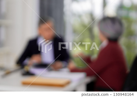 Asian adult lawyer professional client discuss legal consultation business strategy resolving dispute reviewing documents at law office formal setting Asian adult lawyer professional client discuss legal consultation business strategy resolving dispute reviewing documents at law office formal setting 130948164