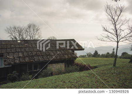 landscape and travel concept with sunrise and layer of mountain and mist with country house landscape and travel concept with sunrise and layer of mountain and mist with country house 130948926