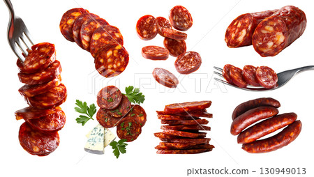 Set of Chorizo cured sausage fermented dried smoky spicy pork meat, with cheese, fork, sliced strips pile stack falling on transparent cutout PNG. Mockup 130949013