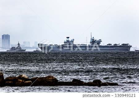 British Navy aircraft carrier HMS Prince of Wales sailing through the Uraga Strait in Tokyo Bay after arriving in Japan 130949121