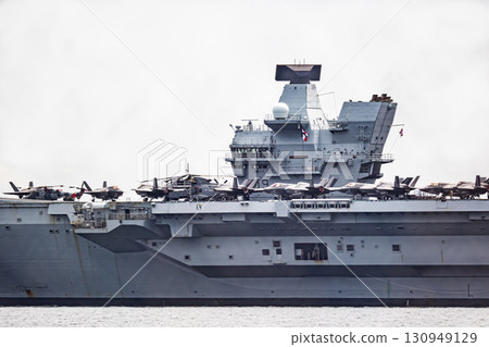 British Navy aircraft carrier HMS Prince of Wales sailing through the Uraga Strait in Tokyo Bay after arriving in Japan 130949129