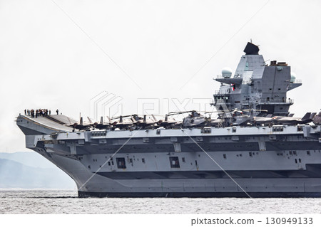 British Navy aircraft carrier HMS Prince of Wales sailing through the Uraga Strait in Tokyo Bay after arriving in Japan 130949133