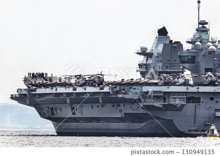 British Navy aircraft carrier HMS Prince of Wales sailing through the Uraga Strait in Tokyo Bay after arriving in Japan 130949135
