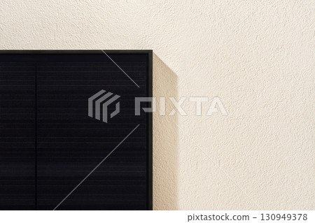 Modern black solar panel installed on white facade Modern black solar panel installed on white facade 130949378