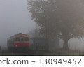 Kiha 200 stopping at Kazusakubo Station in the early morning fog 130949452