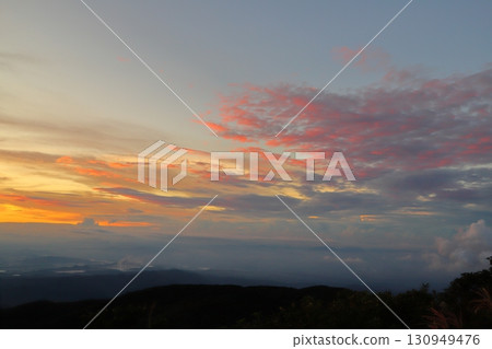 Evening view from the summit: sunset sky Evening view from the summit: sunset sky 130949476