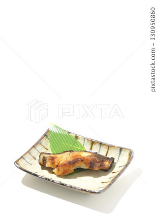 Grilled silver cod in saikyo style on a white background 130950860