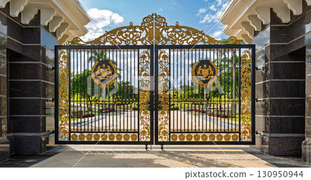 Grand ornate golden gate of Istana Negara, the National Palace, with Malaysia's Coat of Arms, Kuala Lumpur, Malaysia Grand ornate golden gate of Istana Negara, the National Palace, with Malaysia's Coat of Arms, Kuala Lumpur, Malaysia 130950944