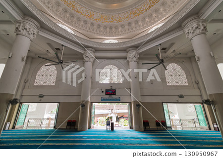 Interior of Al-Bukhari Foundation Mosque, Kuala Lumpur, Malaysia. Islamic architecture, ornate ceiling, and prayer hall 130950967