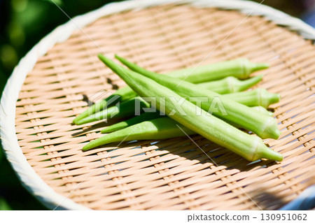 White okra, fresh vegetables served on a bamboo basket 130951062