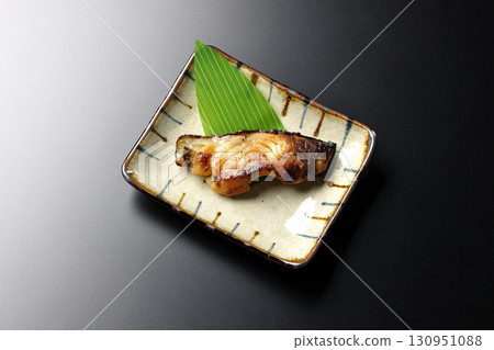 Grilled silver cod in Kyoto style on a black background Grilled silver cod in Kyoto style on a black background 130951088