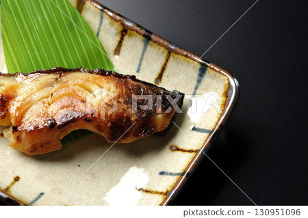 Grilled silver cod in Kyoto style on a black background 130951096