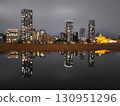 Skyscrapers reflected on the water, a daily night view 130951296