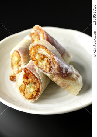 Peking duck photographed against a black background 130951716