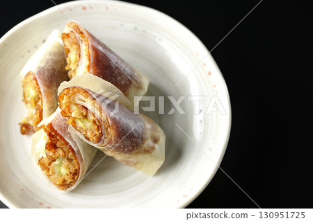 Peking duck photographed against a black background 130951725