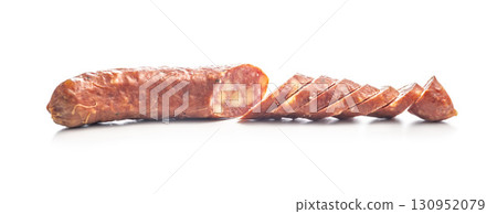 Sliced smoked sausage isolated on white background. Sliced smoked sausage isolated on white background. 130952079