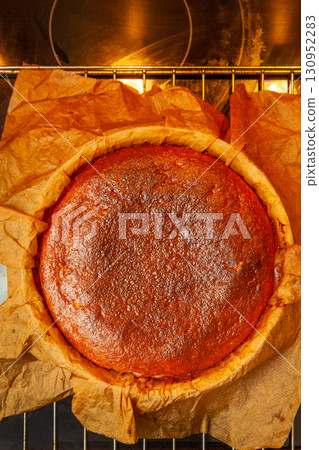 Homemade Basque burnt cheesecake immediately after baking on a rack 130952283