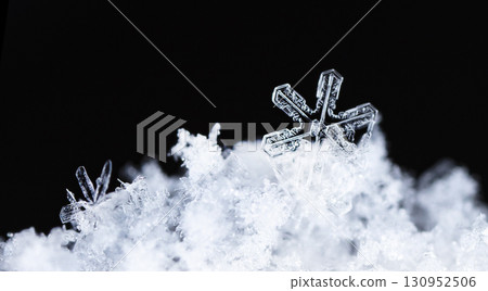 natural snowflakes on snow. the picture is made at a temperature of-10 C natural snowflakes on snow. the picture is made at a temperature of-10 C 130952506