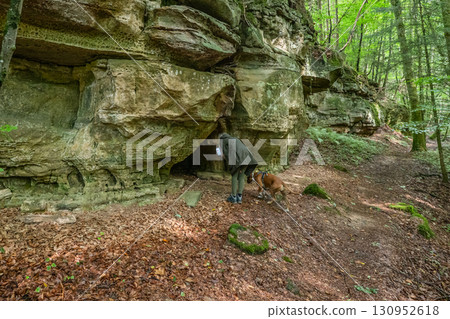 Beautiful green forest Hiking path with Sandstone chalk rock formations in Berdorf Mullerthal Luxembourg Beautiful green forest Hiking path with Sandstone chalk rock formations in Berdorf Mullerthal Luxembourg 130952618