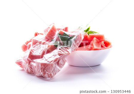 cubes of frozen watermelon in a vacuum bag on a white background cubes of frozen watermelon in a vacuum bag on a white background 130953446