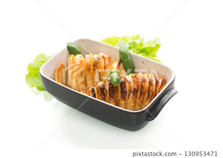 A hearty dish - potatoes from the oven with lard 130953471