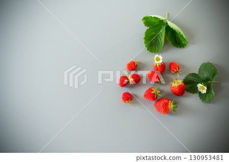 Still life with strawberries, top view on a textured background 130953481