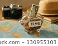 Saving money for travel adventures, planning future trips with camera and map. 130955103