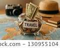 Saving money in a piggy bank for future travel adventures. 130955104