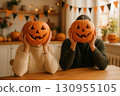 Festive Halloween scene at home with carved jack o lantern pumpkins  130955105