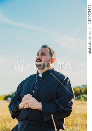 Deacon Praying In The Nature With All His Heart  130955461