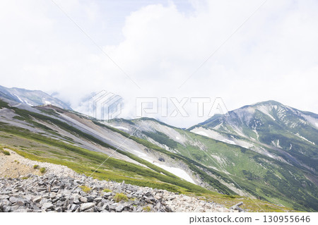 The beautiful ridge of the Northern Alps covered in clouds 130955646
