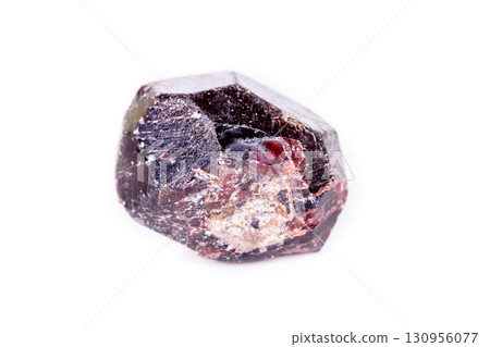 Macro of a mineral garnet stone on a white background Macro of a mineral garnet stone on a white background 130956077