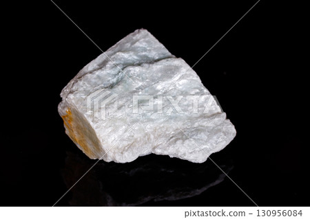 Macro mineral stone Talc on black background 130956084