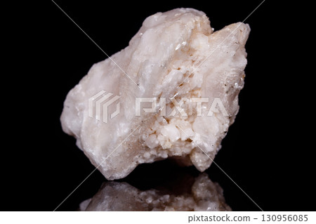 Macro mineral stone Amphibolite in quartz on black background 130956085