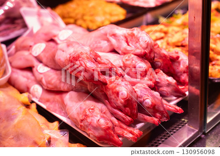 Meat department of supermarket - raw pig carcasses are on display in refrigerator Meat department of supermarket - raw pig carcasses are on display in refrigerator 130956098