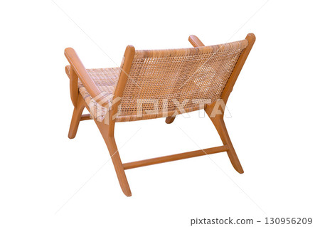 Wooden chair covered with rattan isolated on white background. View from the side offset to the back 130956209