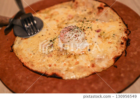 Soft-boiled egg cheese pizza 130956549
