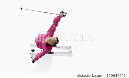 Skier in pink hoodie extending arms dramatically during freestyle motion Skier in pink hoodie extending arms dramatically during freestyle motion 130956632