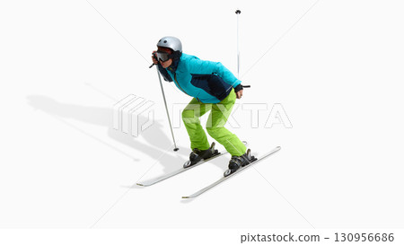 Female skier in bright outfit leaning forward in active downhill pose isolated on white Female skier in bright outfit leaning forward in active downhill pose isolated on white 130956686