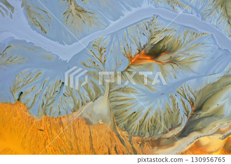 Aerial view of surreal natural patterns of gold cyanide leaching flowing into decanting lake Aerial view of surreal natural patterns of gold cyanide leaching flowing into decanting lake 130956765