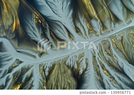 Aerial view of surreal natural patterns of gold cyanide leaching flowing into decanting lake 130956771