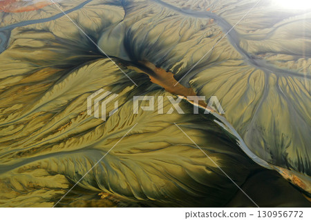 Aerial view of surreal natural patterns of gold cyanide leaching flowing into decanting lake 130956772