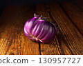 Eggplant on wooden background, fresh juicy vegetable on wooden rustic background, selective focus, soft focus 130957727