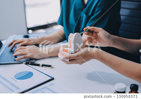 dentist consultation - patient visit at dental clinics office dentist consultation - patient visit at dental clinics office 130958371