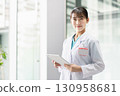 Young female doctor working in hospital 130958681