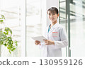 Young female doctor working in hospital 130959126