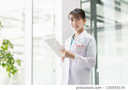 Young female doctor working in hospital Young female doctor working in hospital 130959134