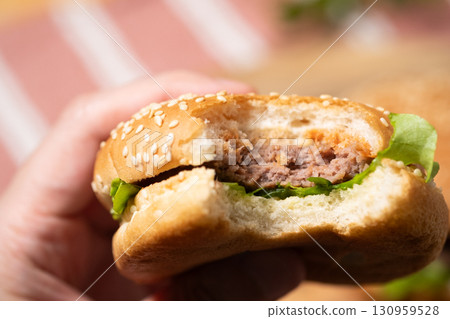 Image of a homemade hamburger (stock photo) Image of a homemade hamburger (stock photo) 130959528