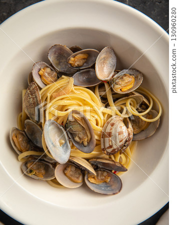 Italian pasta with clams and seafood in bowl Italian pasta with clams and seafood in bowl 130960280